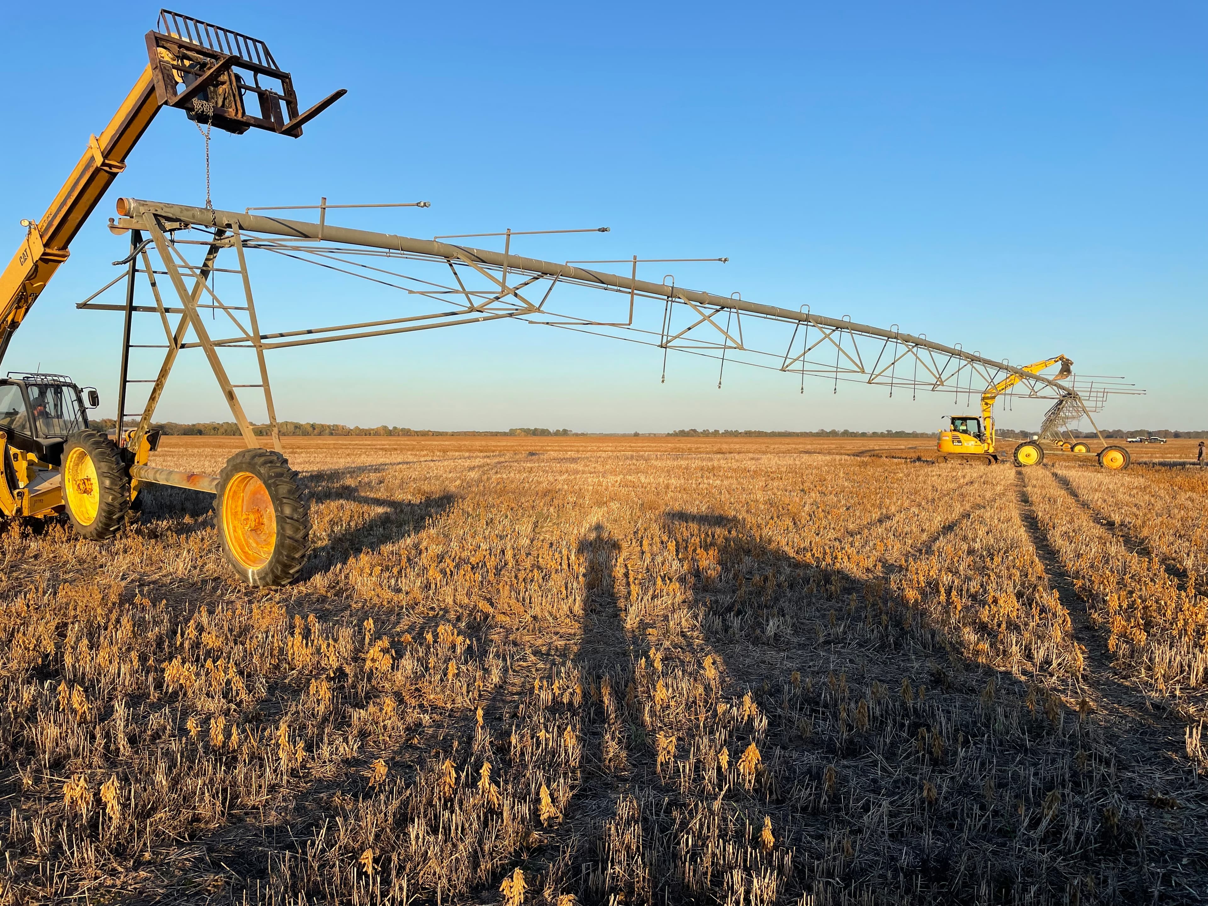 Center pivot relocation with heavy equipment